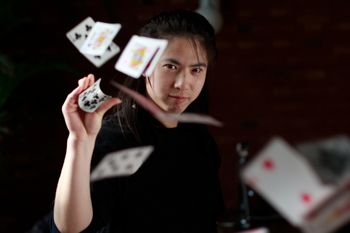 Magician throwing cards: www.istock.com 00008718221