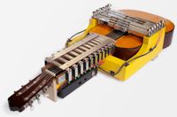 guitarMasheen: a mechanical contraption around a guitar so it can be played by iPad