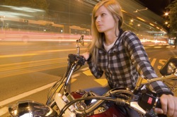 A young woman on a motorcycle
