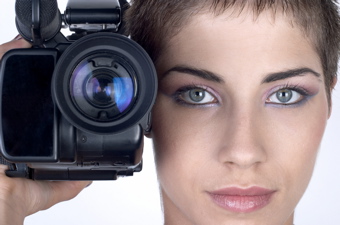 a woman holding a video camera