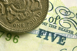 a pound coin and a five pound note
