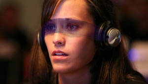 a woman wearing clear wraparound augmented reality glasses