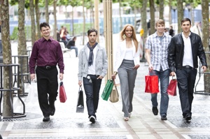 a group of people carrying shopping bags