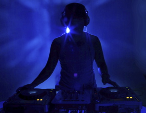 DJ bathed in blue dark