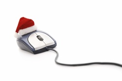 a computer mouse with a Santa hat on top