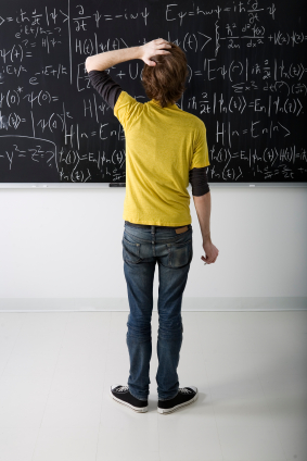 a student contemplates a blackboard full of equations