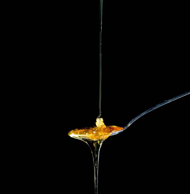 honey streaming on to a spoon